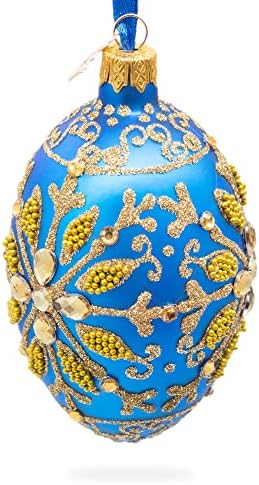 Zlatna pahuljica na plavom staklenom ukrasu od jaja 4 inča